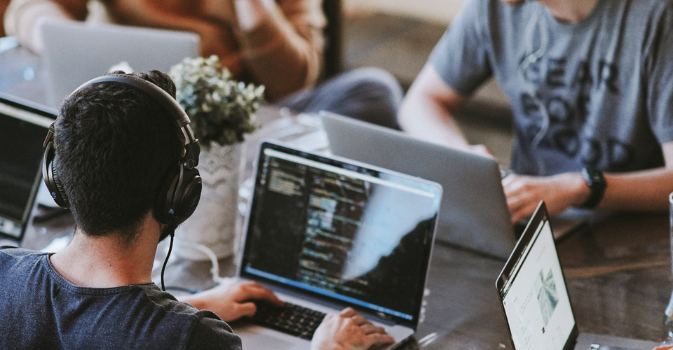 web developers sitting at a desk