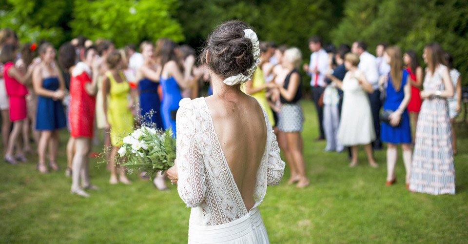 bride tossing flowers