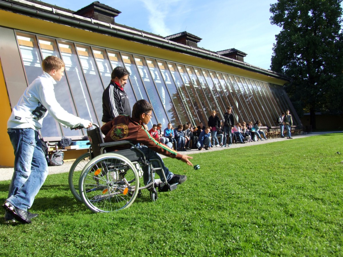 boy in a wheelchair playing