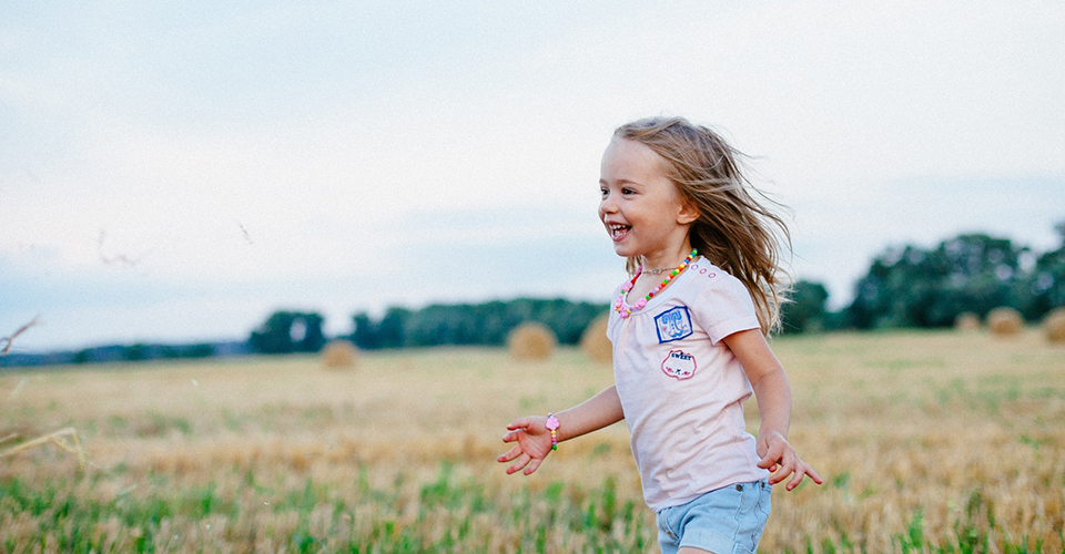 Girl Running Through Field girl running through field