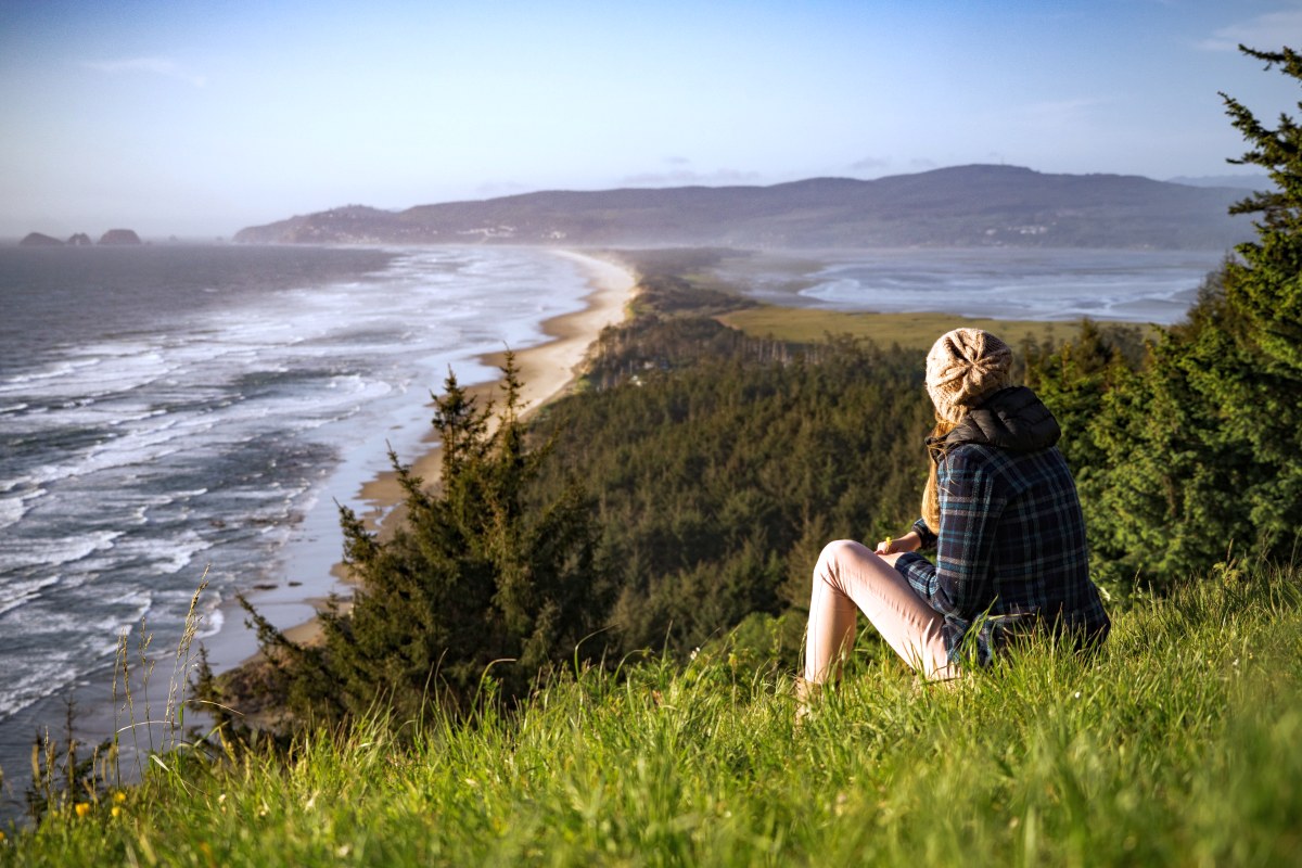 woman sitting on a hill